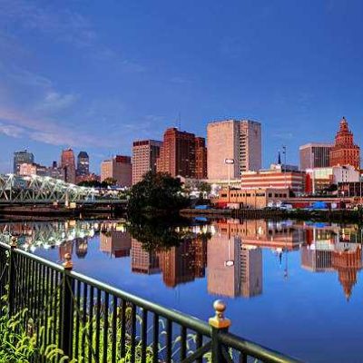 waterfront Newark, clear blue sky, buildings, water