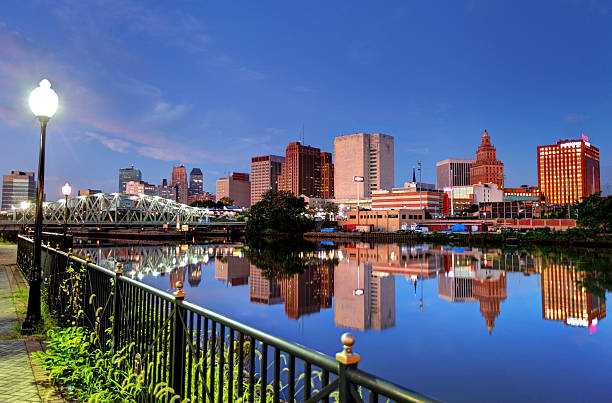 waterfront Newark, clear blue sky, buildings, water