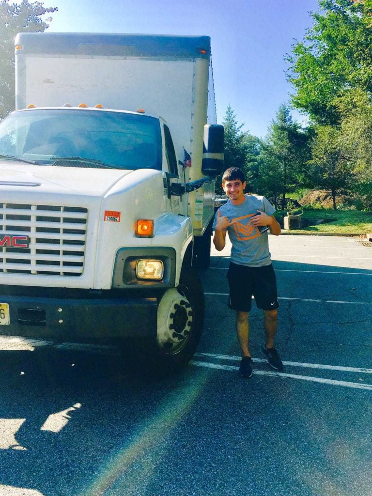 One of our many experienced long distance movers NJ, next to a Vector Movers truck.