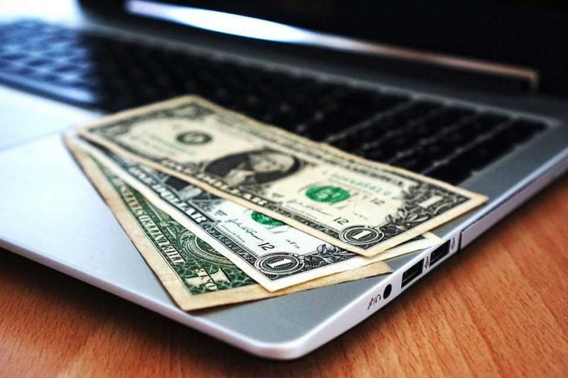 Cash on a laptop - search the web wisely for cheap NJ movers.