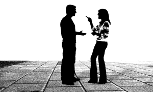 A customer talking to a moving representative, male and female black silhouette