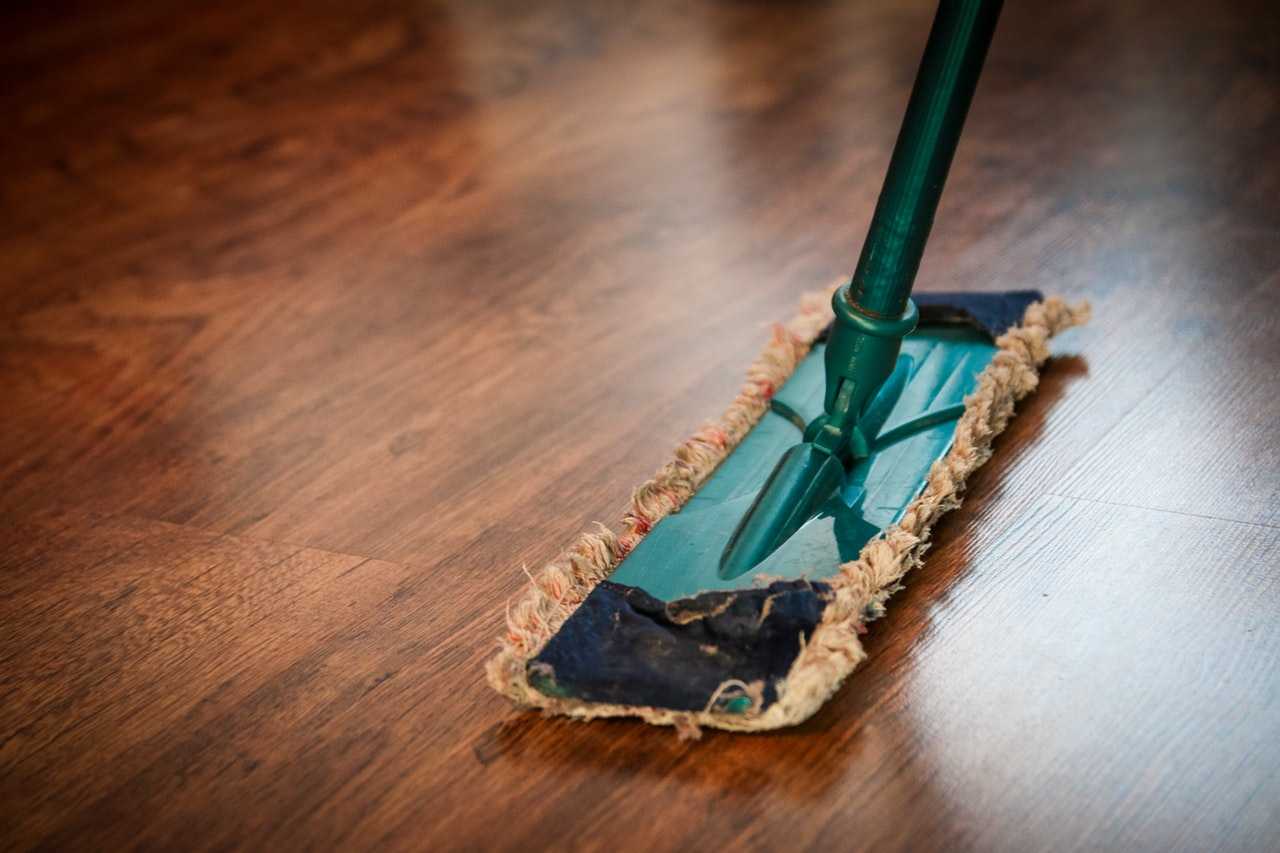 A mop used for cleaning a wooden floor