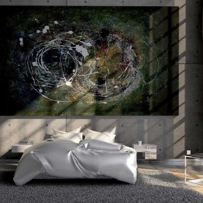 A bedroom with a bed, a carpet and a large abstract painting on the wall