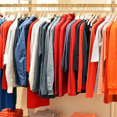 Bunch of clothes on a hangar - packing your clothes like a pro with Vector Movers NJ.