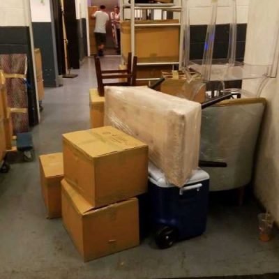 Different goods wrapped and packed in boxes ready to be moved by movers Bloomfield NJ