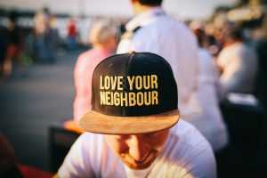 Love your neighbor written on a ball cap