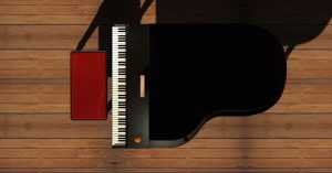 A black piano and a chair on a wooden floor