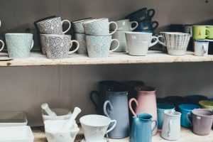 Tea cups sitting on a shelf - time do declutter your home if you don't have use for them all.