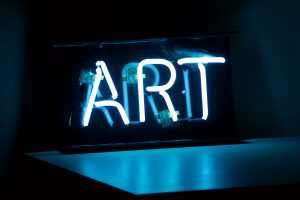 "ART" written in neon lights