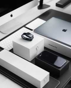 iPhone, Apple watch and a MacBook lying on a table