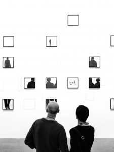 People looking a photos in a gallery