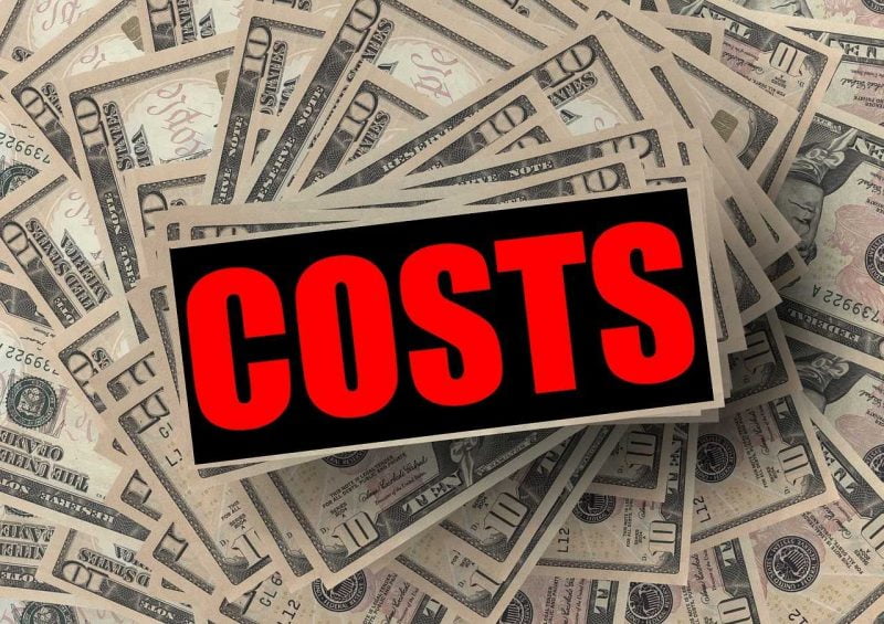 The word "costs" and 10-dollar bills in the background