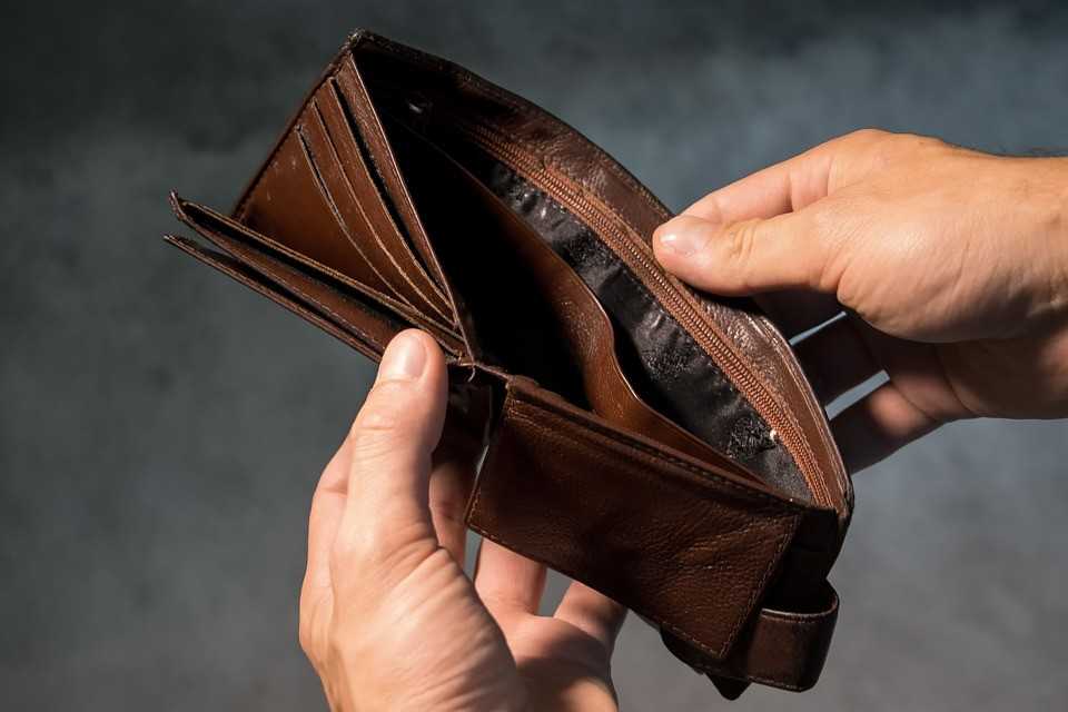 An empty wallet - a sign that you have to find ways to save money.
